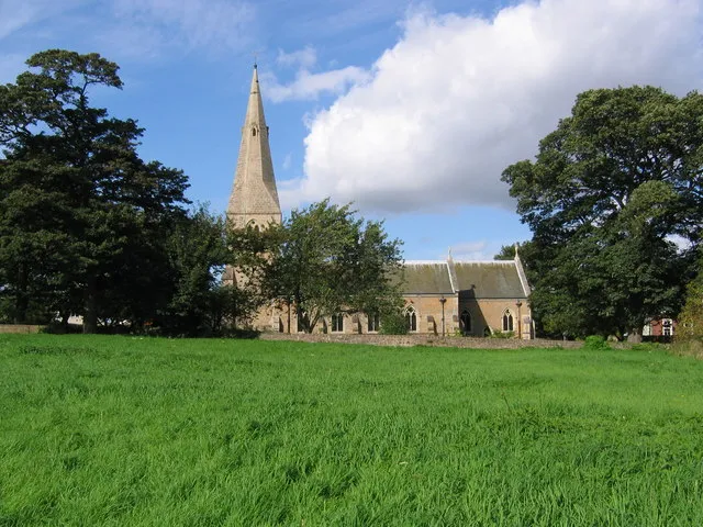 Parish church of St Wilfrid, Kirkby. The Church stands on an ancient site dating back to the 6th Century. The church was rebuilt in 1908 following a fire in 1907, which destroyed all but the tower and spire. The photograph was taken from the footpath to the south of the church and the grassy area in the foreground, known as Castle Hill, was the site of Kirkby Castle which pre-dated the Norman Conquest.