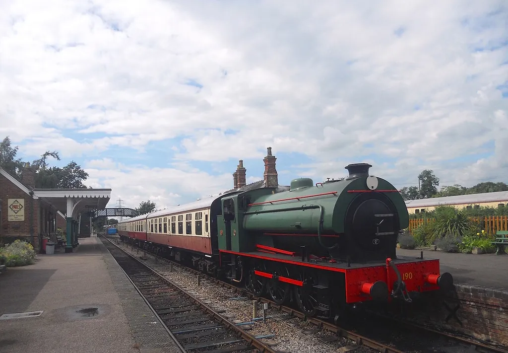 Hunslet 0-6-0ST Austerity WD190 and train at Castle Headingham on the Colne Valley Railway