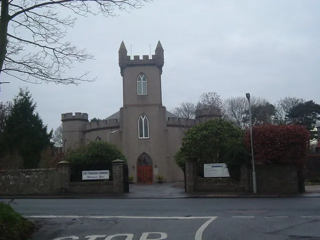 Fetteresso Parish Church Church of Scotland. Replacement (built 1810-12) for the old St Cieran's Church at Fetteresso, with a frontage modelled on Fetteresso Castle.