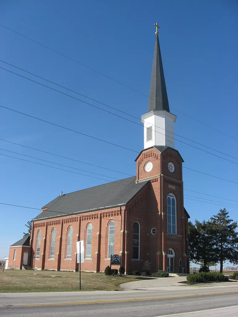 Front and eastern side of St. Aloysius' Catholic Church, located along State Route 274 immediately east of its intersection with U.S. Route 127 at Carthagena, an unincorporated community in Marion Township, Mercer County, Ohio, United States. Built in 1875, the church was added to the National Register of Historic Places as a part of the Cross-Tipped Churches of Ohio Thematic Resources.