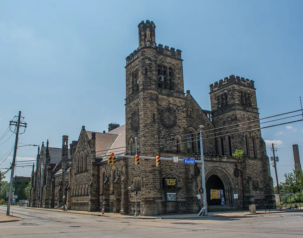 New Life at Calvary Presbyterian Church, located at 2020 E. 79th Street in Cleveland, Ohio, U.S. The Victorian Romanesque Revival style building was designed by famed local Cleveland architect Charles Schweinfurth. Construction began in 1888 and was finished in 1892. The then-predominantly white Calvary Presbyterian congregation formally took a stand against racial segregation in 1953. Itbecame one of the first racially integrated congregations in Cleveland. The building's gymnasium was struck by an EF-1 tornado in 2023, which ripped the roofs off the sanctuary, fellowship hall, and gymnasium.
