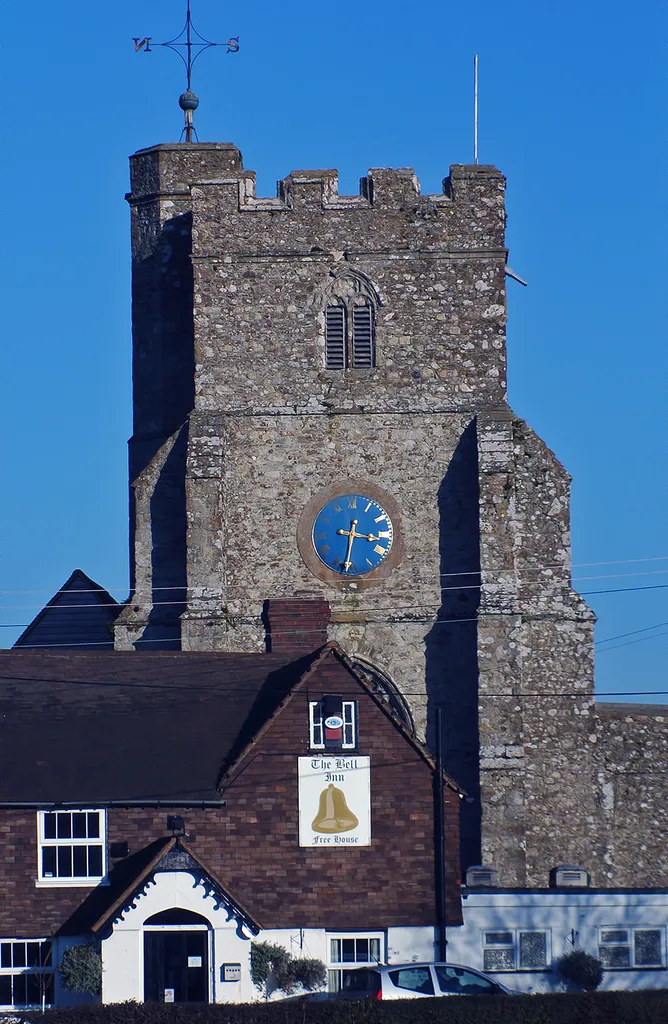 The church tower of the St George's Church at Ivychurch, Kent, UK.