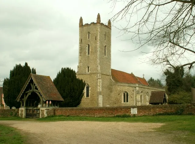 St. Mary's church, Langham, Essex. This church has a Norman nave with a later 13th century tower and 14th century south aisle. The painter, John Constable, lived near here and often sat at the top of this tower to do his work. The church stands in a lovely setting close to Langham hall and Langham farm. This is a photo of listed building number 1223452.