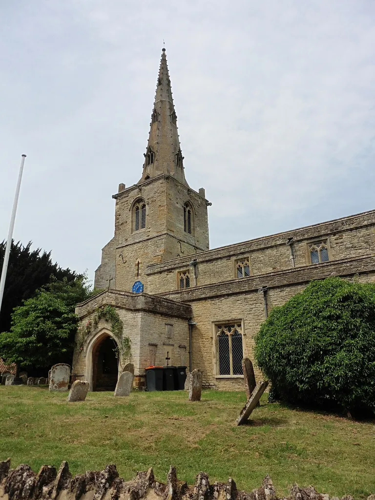 Steeple and south porch of the parish church of St Mary the Virgin, Podington, Bedfordshire, seen from the southeast