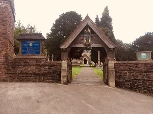 Lychgate, churchyard walls and railings to Church of Saint Basil