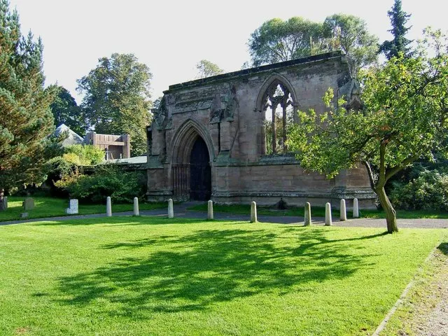 North wall of the nave of the Gothic Revival parish church of St Michael and All Angels, Stourport-on-Severn, Worcestershire, seen from the northwest. On the left in the background is the present parish church, completed in 1980.