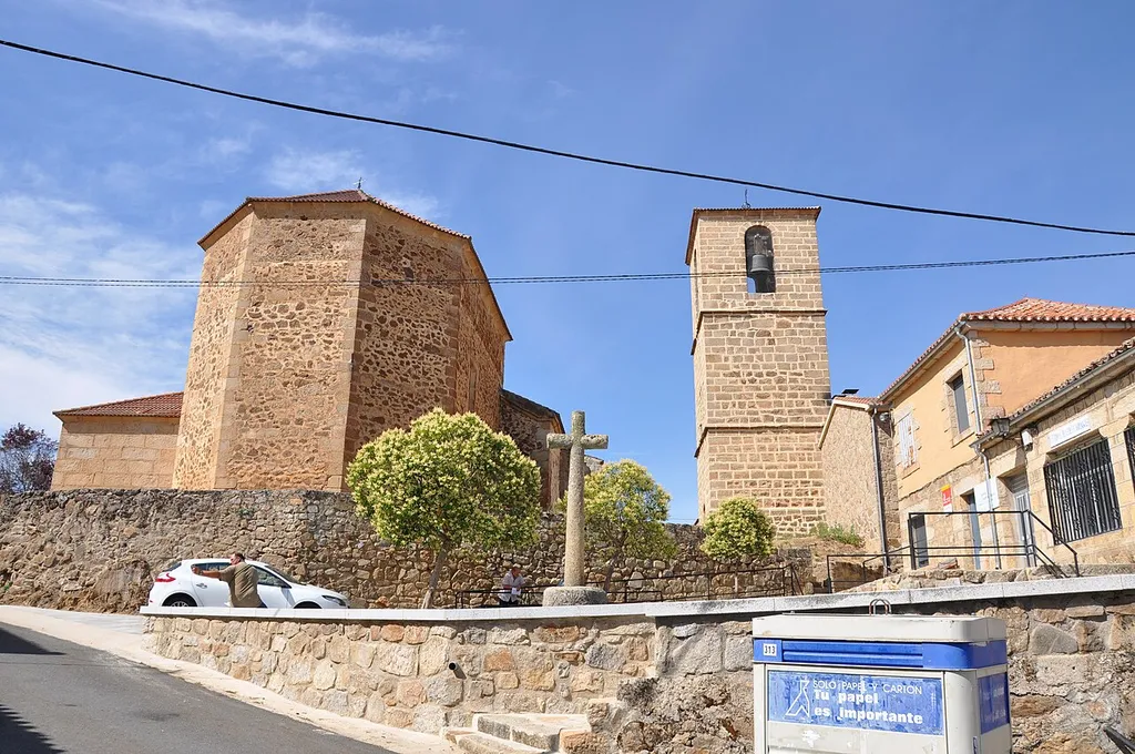 View of the church and the exempt bell tower in Santiago del Collado, Ávila, Spain
