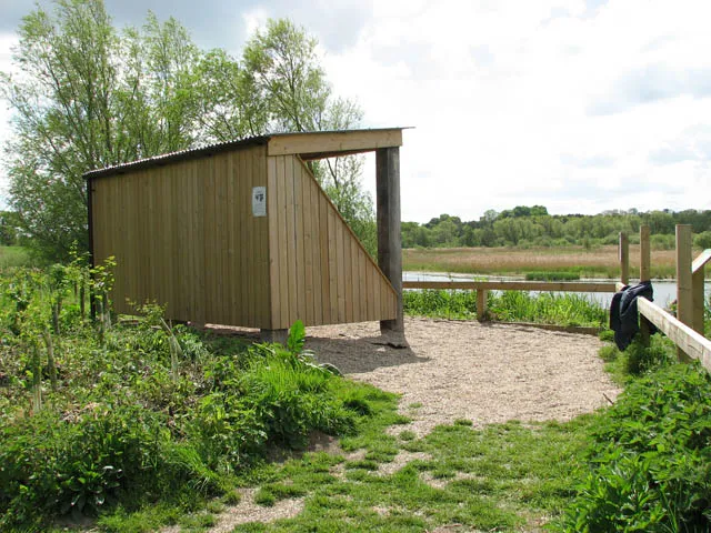 Shelter by Surlingham Church Marsh. In spring and summer, marsh harriers, kingfishers, water rails, and reed and sedge warblers can be seen in this small nature reserve which can be accessed via a circular walk which starts and ends by St Mary's church > https://www.geograph.org.uk/photo/1280845. Dogs are only allowed on public footpaths and bridleways. A great variety of wild flowers and plants, some of these rare such as marsh orchids and mild parsley, can be seen and in order to maintain and improve diversity, Highland Cattle is grazed here during the summer months. The site floods in winter, attracting bitterns, gadwalls and shovelers.