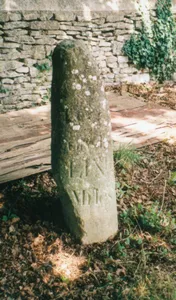 Milestone, by Church, on lane by Bletchingdon Park, in front of wall around church