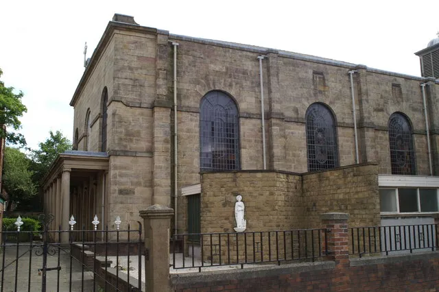 St John's RC Church, Wigan Sitting over the road from St George's CofE Church, it is a very near neighbour of St Mary's RC Church, and is run by the same clergy. Built by an 'Unknown Jesuit' in 1819.