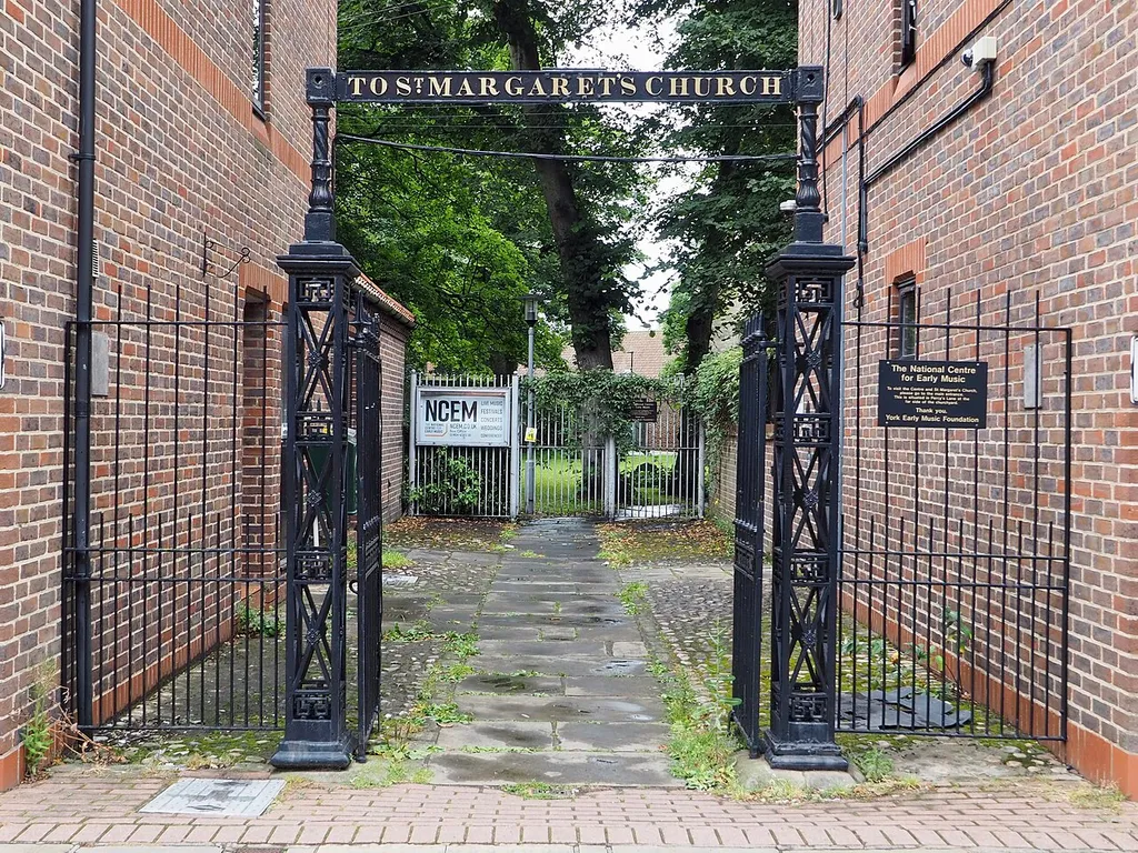 Gate approximately 100 metres south west of St Margaret Church, Walmgate, York. .mw-parser-output .messagebox{margin:4px 0;width:auto;border-collapse:collapse;border:2px solid var(--border-color-progressive,#6485d1);background-color:var(--background-color-neutral-subtle,#fbfcff);color:var(--color-base,#202122);box-sizing:border-box;border-inline-start-width:8px}.mw-parser-output .messagebox.mbox-small{font-size:88%;line-height:1.25em}.mw-parser-output .mbox-warning,.mw-parser-output .mbox-speedy{border:2px solid var(--border-color-error,#b22222);background:var(--background-color-error-subtle,#ffdbdb);border-inline-start-width:8px}.mw-parser-output .mbox-serious,.mw-parser-output .mbox-delete,.mw-parser-output .mbox-stop{border:2px solid var(--border-color-error,#b22222);border-inline-start-width:8px}.mw-parser-output .mbox-issue,.mw-parser-output .mbox-content{border:2px solid #f28500;background:var(--background-color-warning-subtle,#ffe);border-inline-start-width:8px}.mw-parser-output .mbox-query,.mw-parser-output .mbox-style{border:2px solid #f4c430;background:var(--background-color-warning-subtle,#ffe);border-inline-start-width:8px}.mw-parser-output .mbox-shit{border:2px solid #960;border-inline-start-width:8px}.mw-parser-output .mbox-license{border:2px solid #88a;border-inline-start-width:initial}.mw-parser-output .mbox-legal{border:2px solid var(--border-color-notice,#666);background:var(--background-color-base,#fff);border-inline-start-width:8px}.mw-parser-output .mbox-honor{border:2px solid #ca3;background:var(--background-color-warning-subtle,#fcf4db);border-inline-start-width:8px}.mw-parser-output .mbox-growth{border:2px solid #8d4;background:var(--background-color-success-subtle,#d5fdf4);border-inline-start-width:8px}.mw-parser-output .mbox-move{border:2px solid #93c;border-inline-start-width:8px}.mw-parser-output .mbox-protection,.mw-parser-output .mbox-message{border:2px solid var(--border-color-base,#aaa);border-inline-start-width:8px}.mw-parser-output 