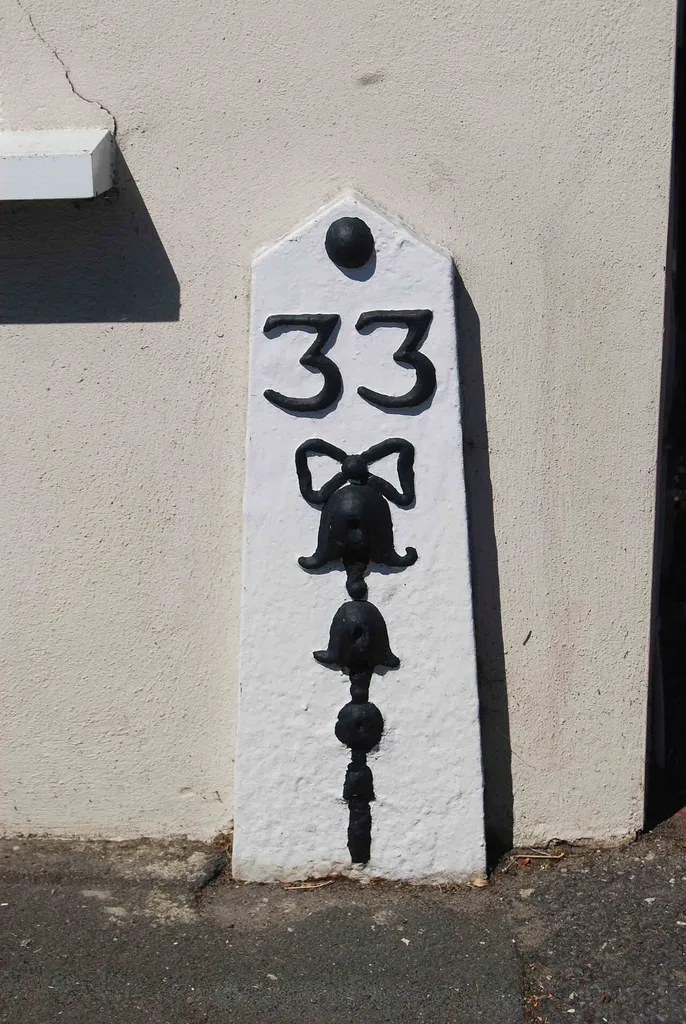 Milestone, London Road, near furniture shop