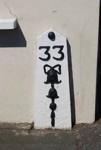 Milestone, London Road, near furniture shop
