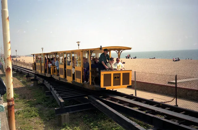 Volk's Electric Railway A pair of cars of the pioneering Volk's Electric Railway are approaching the Aquarium terminus, the western end of the line, in 1998. Current car no.8 carried no.5 between 1948 and 2000.