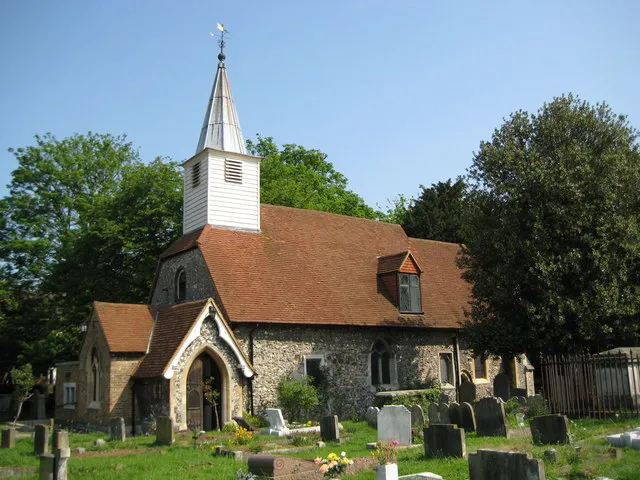 Cowley: Church of St Laurence This attractive little church is on the east side of Church Road and at the eastern extremity of Cowley. Apart from the fact that Roman remains were found here in 1959 I can find no other information about the church on the internet. From a cartographical point of view this is a fine illustration of the relative inaccuracies of the Ordnance Survey 1:50,000 scale mapping. This shows the symbol for a church with a steeple clearly in the adjacent grid square TQ0682, but using the more accurate 1:10,000 scale mapping the church is clearly mainly in this grid square. This was an unplanned and inadvertent copy of a Francis Frith image of around 1955, here http://www.francisfrith.com/search/england/middlesex/cowley/photos/cowley_C581006.htm