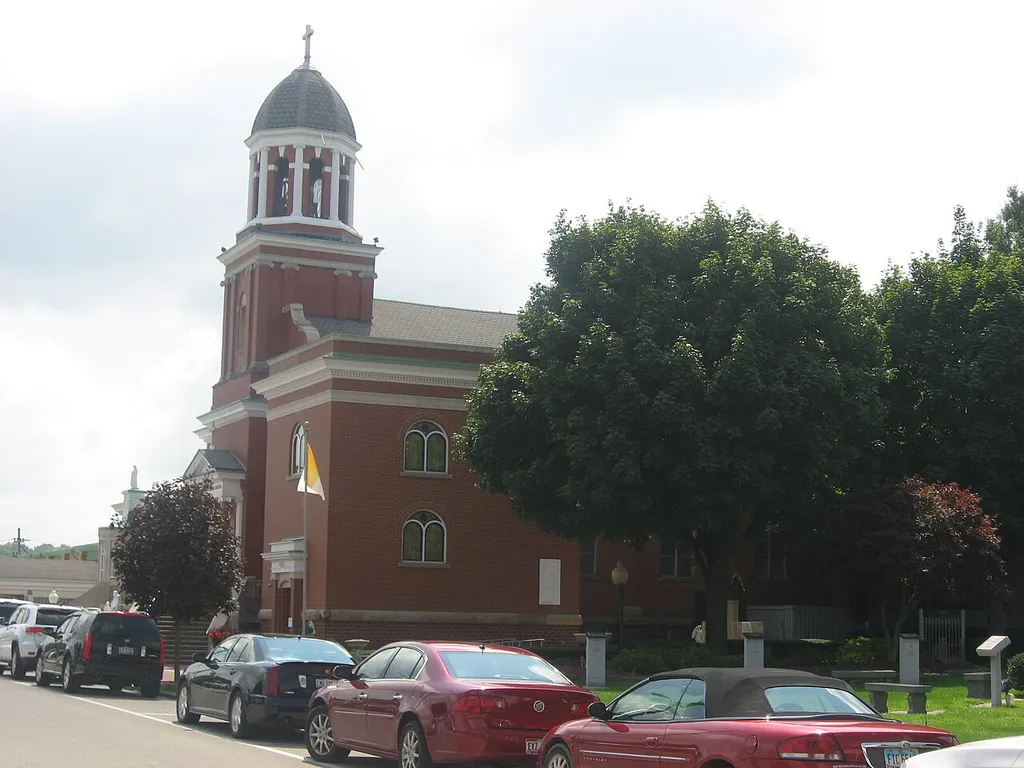 Western side and front of Our Lady of Mount Carmel Church, located at 343 Via Mount Carmel Avenue in Youngstown, Ohio, United States. Built in 1913, it is listed on the National Register of Historic Places.