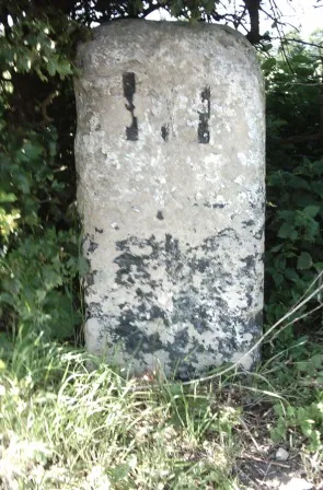 Milestone, Newmarket Road, W of Greenhouse Farm, nr airport