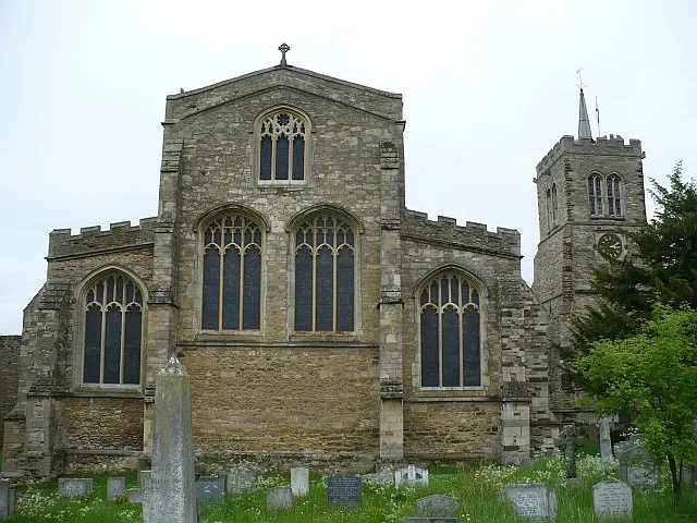 SS Mary and Helena parish church, Elstow, Bedfordshire, seen from the east. The present church is the nave and aisles of the former Abbey church. After the Dissolution of the Monasteries in the 16th century the chancel and central tower were demolished and the east wall seen here was built to close the east end of the nave and aisles. All of the present east windows were re-worked when the church was restored in 1881.