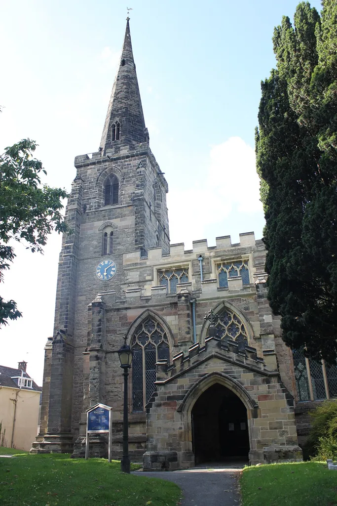 St Andrew's Parish Church in Kegworth, Leicestershire was largely built in 1370 but the tower base dates earlier, from 1250. The church is the main landmark of the village and is situated next to the commercial center. This view is of the southern side, showing the main entrance.