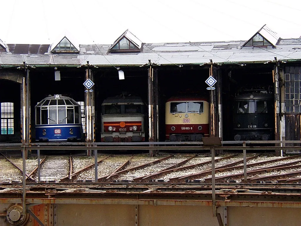 A parade of locomotives in the Europa Roundhouse at the Augsburg Railway Park, Bavaria, Germany.
