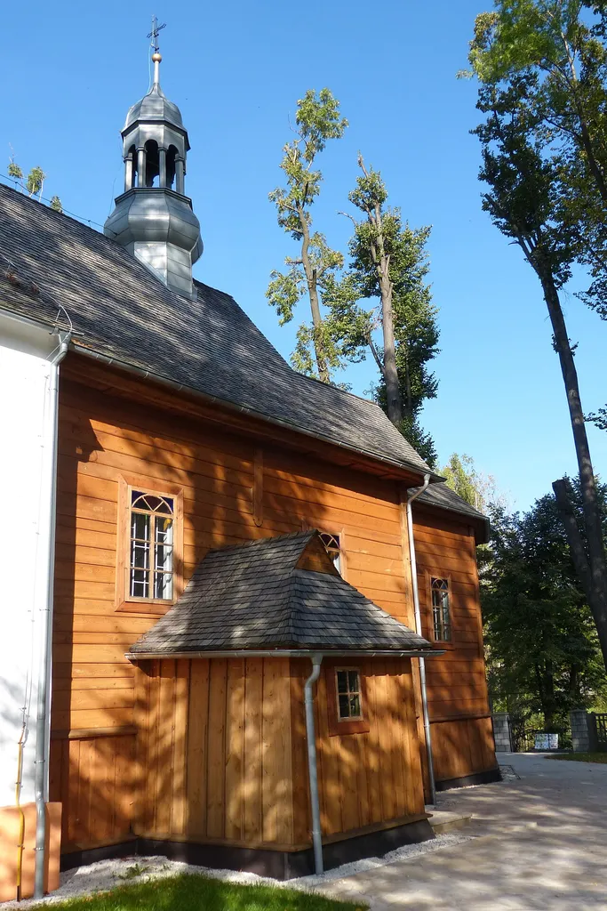 Parish church of St Martin in Poręba Dzierżna, wooden nave and southern entrance.