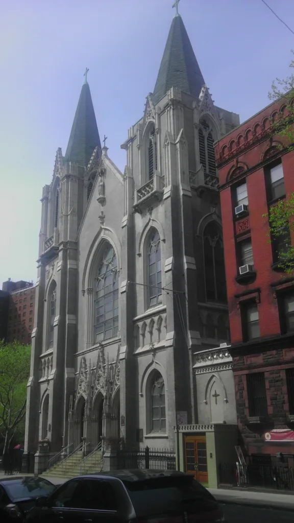 Looking north across 141st Street at St Charles Borromeo Church Harlem.