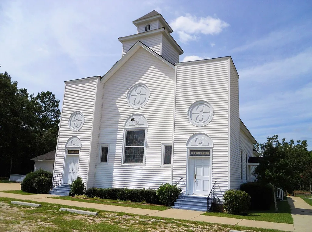 This is a photograph of the Midway Baptist Church located in the Sunnyside School-Midway Baptist Church and Midway Cemetery Historic District in Hamilton, Georgia.