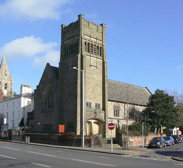 First Church of Christ, Scientist, Mansfield Road, Nottingham, seen from the south. Built in 1896 as a Presbyterian church. It has recently become a Sikh gurdwara. In the background on the left are the tower and spire of St Andrew's parish church.