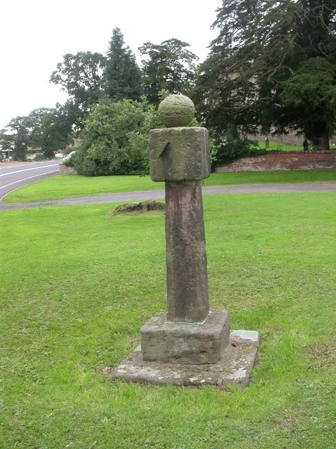 Multi-faced vertical sundial in Adderley, Shropshire, dated 1774 in local records. Two of its gnomons survive in place.