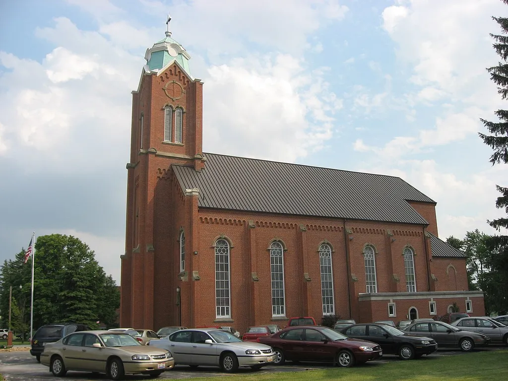 Northern side of All Saints Catholic Church (formerly St. Boniface's Catholic Church), located along N. Perry Street (State Route 587) in New Riegel, Ohio, United States. Built in 1875, it is listed on the National Register of Historic Places.