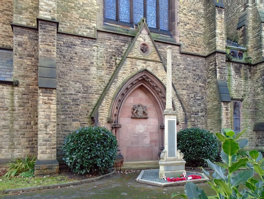 Grade II listed war memorial at east end of the church