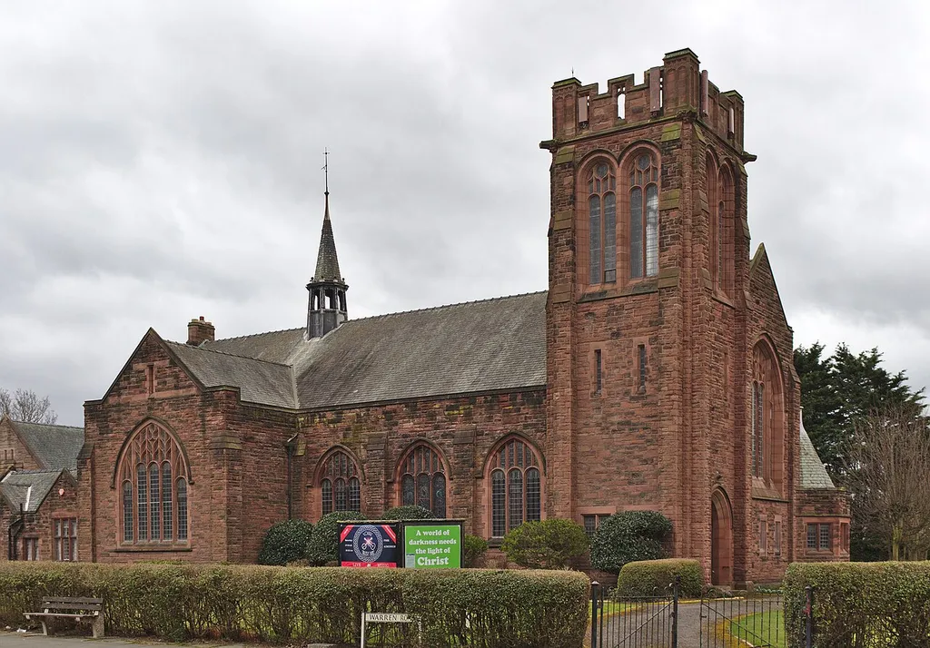 North side and tower of the Grade II listed Blundellsands United Reformed Church from Warren Road