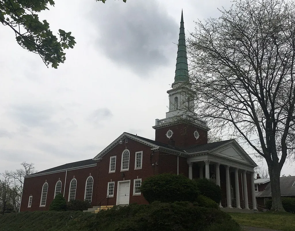 The First Church of Christ, Scientist in Mt. Lebanon, Pennsylvania on a cloudy April day in 2021. This church has been demolished on 12-22-2021, and this is my only photo of it. Sorry for the poor quality photo.