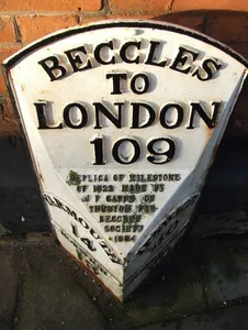 Milepost, by the Townhall, opp. Church