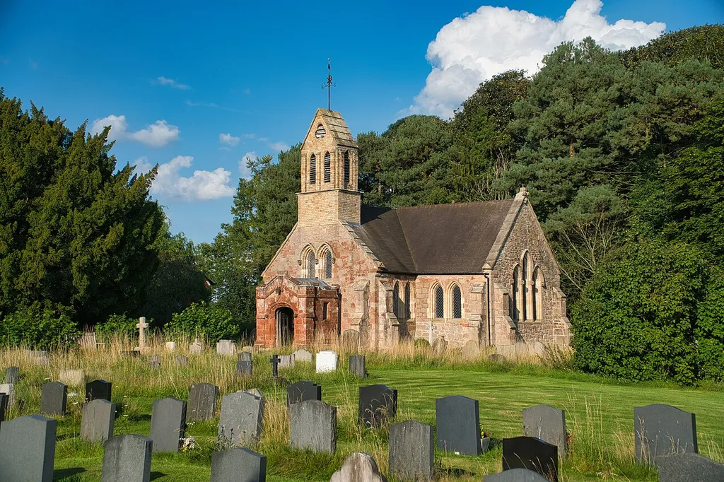 Church of St Mary, Knockin, Shropshire, view from the S-W. At right (at east end of the church) is the remnant of the motte of Knockin Castle, now covered in trees. "Knockin Chapel" was "perhaps founded by Ralph le Strange (of Knockin Castle), but certainly given by him to Haughmond Abbey about 1190-95" (Eyton's Antiquities of Shropshire, Vol.X, p.371[1]). The Le Strange family held under the overlordship of FitzAlan. "Between the years 1204 and 1210, Reyner, Bishop of St. Asaph, granted and confirmed Knockin Chapel to Haghmon Abbey, "according to the Deed and concession of Ralph le Strange, Lord of the Fee". The Anglo-Norman surname "Le Strange" was Latinised as "Extraneus", meaning "The Foreigner/Stranger". Text from: Mel Lockie www.melocki.org.uk [2] The following account of the Parish is taken from my History of the Diocese of St Asaph, Vol. III., pp. 11-15, which is itself much indebted to Eyton's Antiquities of Shropshire, x., pp. 371-377. Until near the end of the twelfth century this parish was an integral part of Kinnerley, but between 1182-95, Radulphus Extraneus (Ralph L'Estrange) founded the " Chapel of Knockyn," and gave the patronage, with its appurtenances, to Haughmond Abbey; and between 1197-1200, his successor, John L'Estrange, gave and confirmed to the said abbey the "new Chapel of Knockyn, with the ground whereon it was built, with free access, and with all its appurtenances and obventions," and " all the land of Norslene with the upper pool near his castle of Knockin." Their respective shares in the tithes were settled about the same time by a charter of Bishop Reyner, which ordered " quod persona de Knokin tenebit omnes decimas de Knokin et de Norslepe et omnes obvenciones earundem villarum praeter sepulturam et medietatem testamenti, annuatim solvendo xiid. predicte ecclesie de Kinardesley in festo Sancte Brigide." Between 1204-10 Bishop Reyner further confirmed Ralph L'Estrange's grant of the chapel to Haughmond Abbey, and invested Ralph, the