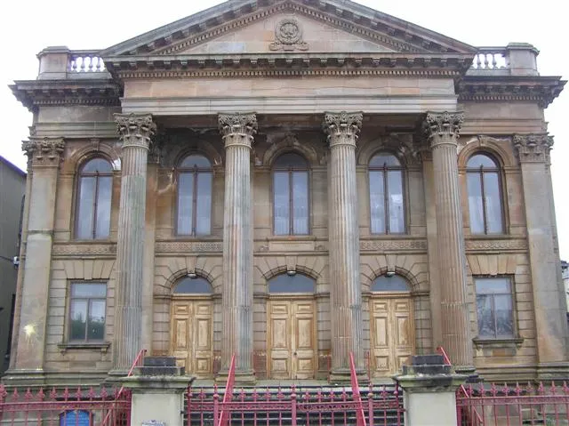 First Derry Presbyterian Church. Located at Upper Magazine Street in Derry / Londonderry. It was demolished in 1777 and rebuilt in 1780. The facade was added in 1903 First opened in 1780, this Church is believed to be on the site of an earlier Presbyterian Church of 1690. The foundation stone of this earlier building is now above the centre door inscribed with Roman numerals M.D.C.X.C. (1690). In 1828 the pediment and cornices of Dungiven sandstone were added. http://www.discovernorthernireland.com/product.aspx?ProductID=3373