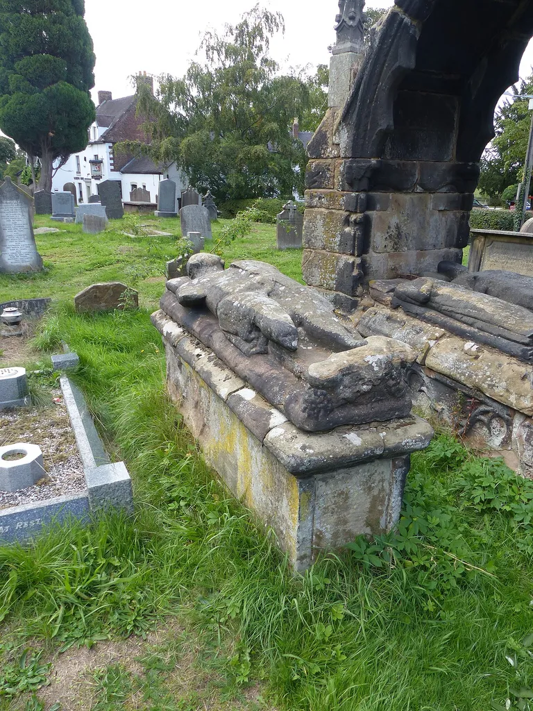 Grade II listed tombstone in the churchyard of St Mary's, Astbury, Cheshire. Listed as "Tombstone circa 1 yard to south of the Venables tomb in Churchyard of St. Mary at NGR 8463 6158". The Venables tomb (listed at Grade II*) is behind. .mw-parser-output .messagebox{margin:4px 0;width:auto;border-collapse:collapse;border:2px solid var(--border-color-progressive,#6485d1);background-color:var(--background-color-neutral-subtle,#fbfcff);color:var(--color-base,#202122);box-sizing:border-box;border-inline-start-width:8px}.mw-parser-output .messagebox.mbox-small{font-size:88%;line-height:1.25em}.mw-parser-output .mbox-warning,.mw-parser-output .mbox-speedy{border:2px solid var(--border-color-error,#b22222);background:var(--background-color-error-subtle,#ffdbdb);border-inline-start-width:8px}.mw-parser-output .mbox-serious,.mw-parser-output .mbox-delete,.mw-parser-output .mbox-stop{border:2px solid var(--border-color-error,#b22222);border-inline-start-width:8px}.mw-parser-output .mbox-issue,.mw-parser-output .mbox-content{border:2px solid #f28500;background:var(--background-color-warning-subtle,#ffe);border-inline-start-width:8px}.mw-parser-output .mbox-query,.mw-parser-output .mbox-style{border:2px solid #f4c430;background:var(--background-color-warning-subtle,#ffe);border-inline-start-width:8px}.mw-parser-output .mbox-shit{border:2px solid #960;border-inline-start-width:8px}.mw-parser-output .mbox-license{border:2px solid #88a;border-inline-start-width:initial}.mw-parser-output .mbox-legal{border:2px solid var(--border-color-notice,#666);background:var(--background-color-base,#fff);border-inline-start-width:8px}.mw-parser-output .mbox-honor{border:2px solid #ca3;background:var(--background-color-warning-subtle,#fcf4db);border-inline-start-width:8px}.mw-parser-output .mbox-growth{border:2px solid #8d4;background:var(--background-color-success-subtle,#d5fdf4);border-inline-start-width:8px}.mw-parser-output .mbox-move{border:2px solid #93c;border-inline-start-width:8px}.mw-p