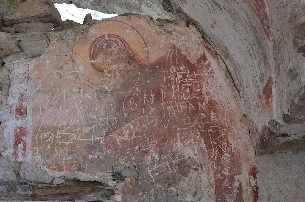 Damaged Virgin Mary fresco found on the inner wall of the church