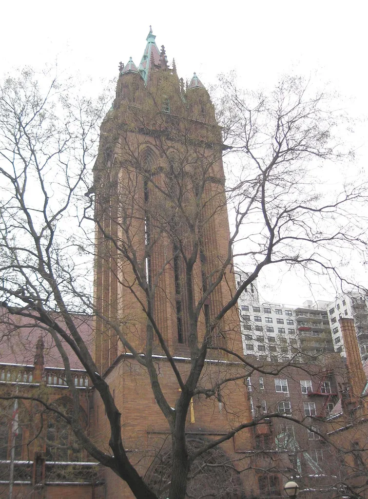 Looking southwest across East 88th Street at the Episcopalian Church of the Holy Trinity on a cloudy afternoon. It's on en:National Register of Historic Places listings in Manhattan above 59th to 110th Streets and designated by NYCLPC in 1967, Guidebook map 16.