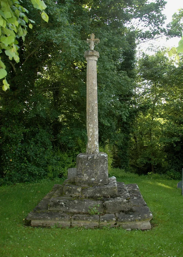 Cross in Holy Cross parish churchyard, Shipton-on-Cherwell, Oxfordshire. The base is late 14th- or early 15th-century. The shaft and cross are late 19th century.