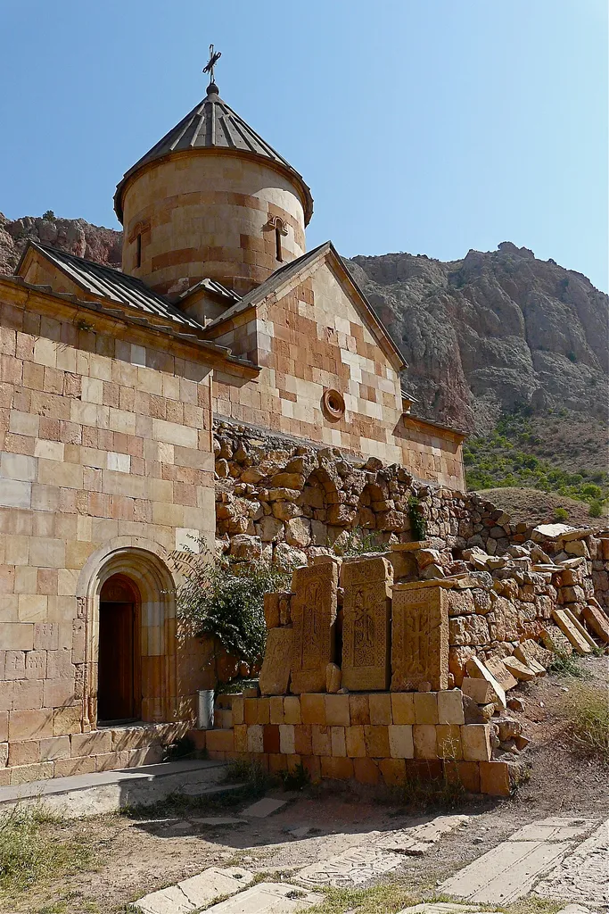 Southern façades of the gavit (left) and of Surp Karapet (right), with ruins of the first Surp Karapet church. Noravank, Vayots Dzor, Armenia.