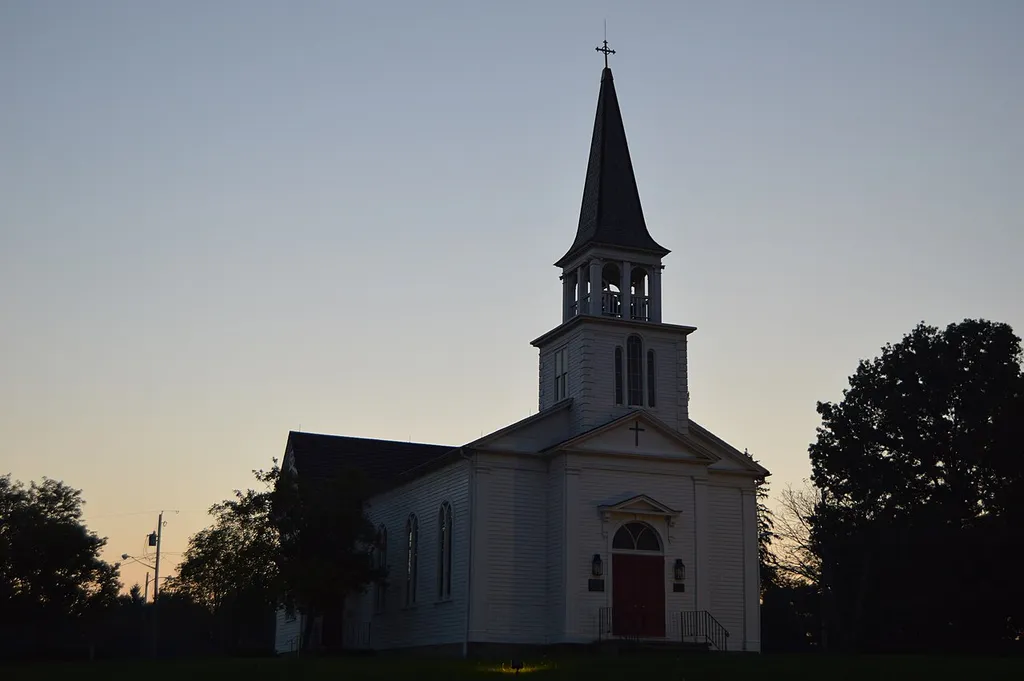 Front and southern side of St. James Episcopal Church, located off U.S. Route 224 in the Boardman Park in Boardman Township, Mahoning County, Ohio, United States. Built in 1828 and relocated to this location in the 1970s, it is listed on the National Register of Historic Places.