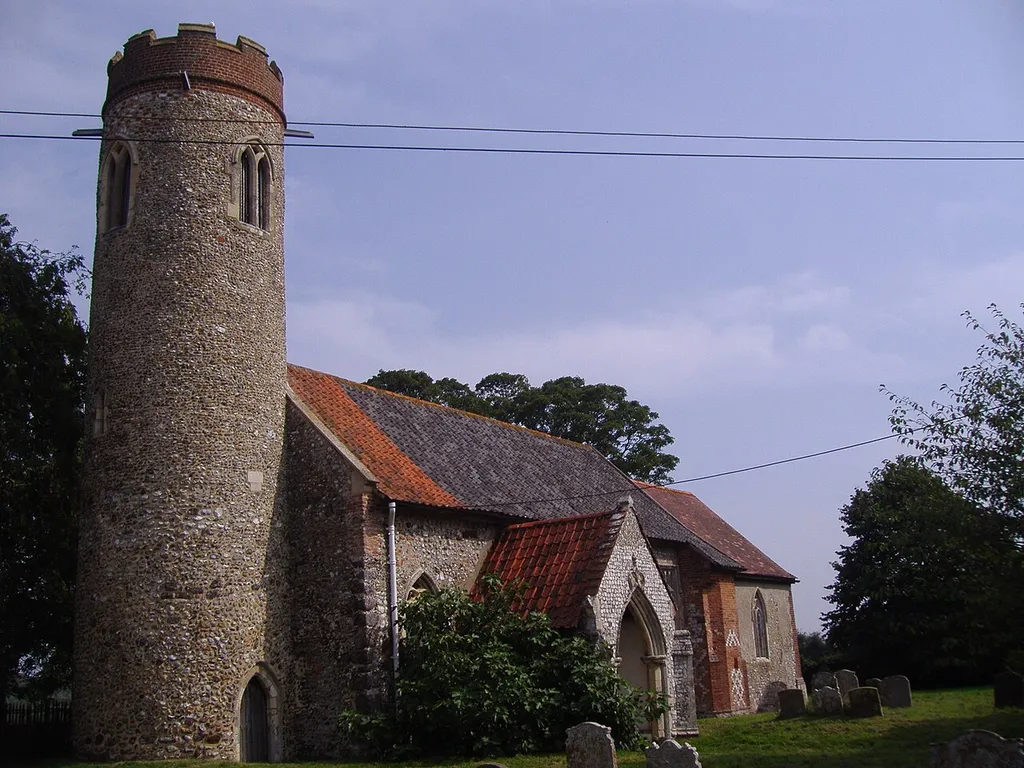 The round tower at Saint Peter and Saint Paul parish church in the village of Sustead in Norfolk