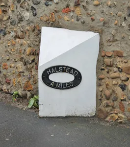 Milepost, opposite Church