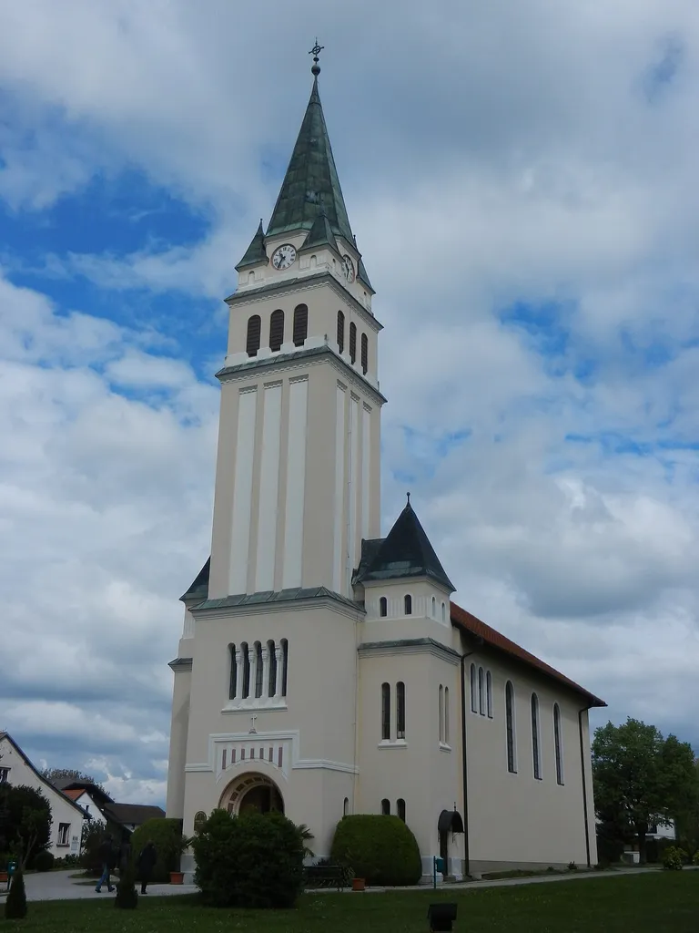 Good Shepherd Lutheran Church in Moravske Toplice, Slovenia. The Neo-Romanesque tower was built in 1925 (plans by Ödön Hochholzer, d. 1955), the mid-century modern nave was added between 1960 and 1962.