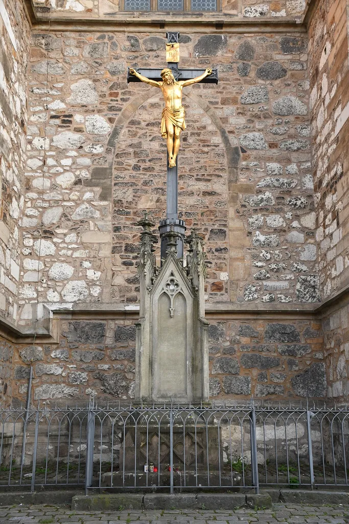 Crucifix in front of north facade of the Cathedral of Saints Peter and Paul in Brno