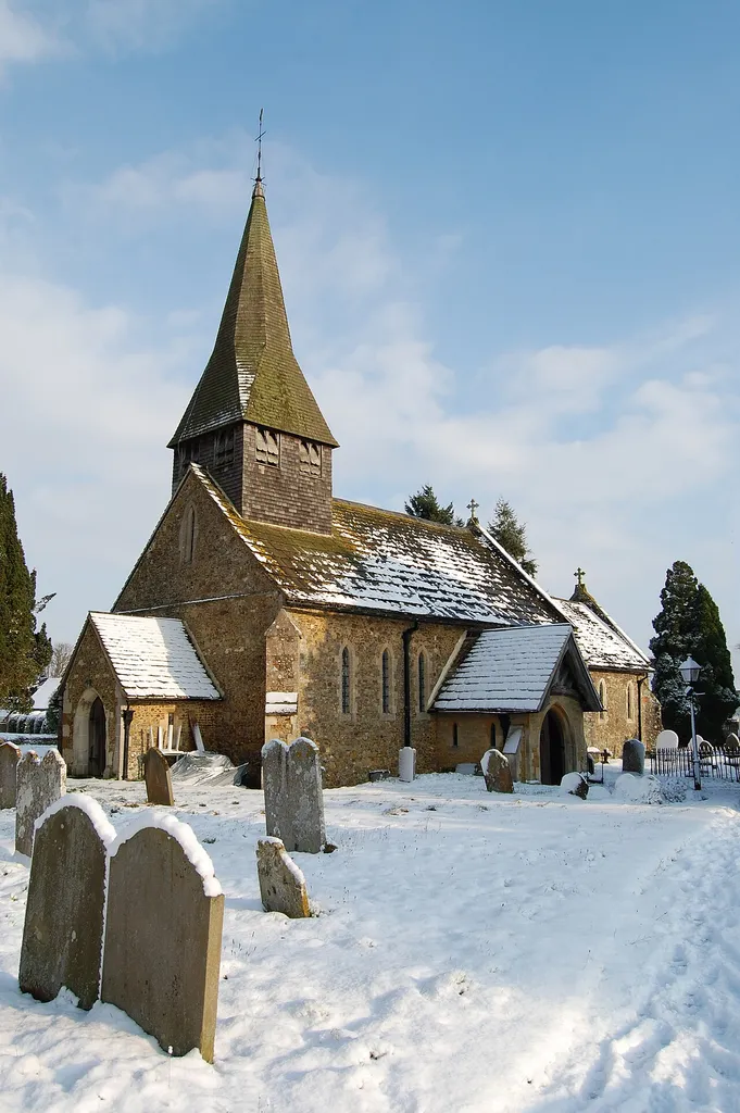St John the Baptist parish church, Capel, Dorking, Surrey, seen from the southwest in snow
