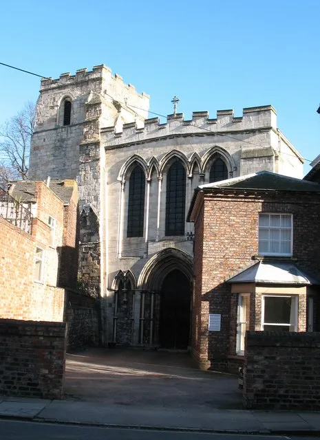 Holy Trinity church, Micklegate. Seen here from Priory Street, Holy Trinity is a puzzling church from the outside with walls and features that don't seem to quite match. The tower and parts of the body of the church are survivals from Holy Trinity Priory (see also 673252)
