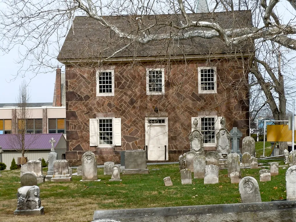 Old St. Gabriel's Episcopal Church on the NRHP since March 8, 1978. On U.S. Route 422 (going south on the split highway, turn at the Wawa if you're headed north) in Douglassville, Amity Township, Berks County, Pennsylvania. This building built 1801, but the congregation goes back to 1720 as a Swedish Lutheran Church, in 1760 changed to Anglican (Protestant Episcopal). The "new" church (1860's?) is behind the old one in the photo (Steeple, chimney). Historical marker (PHMC) in front says Anthony Sadowski is buried in the churchyard.