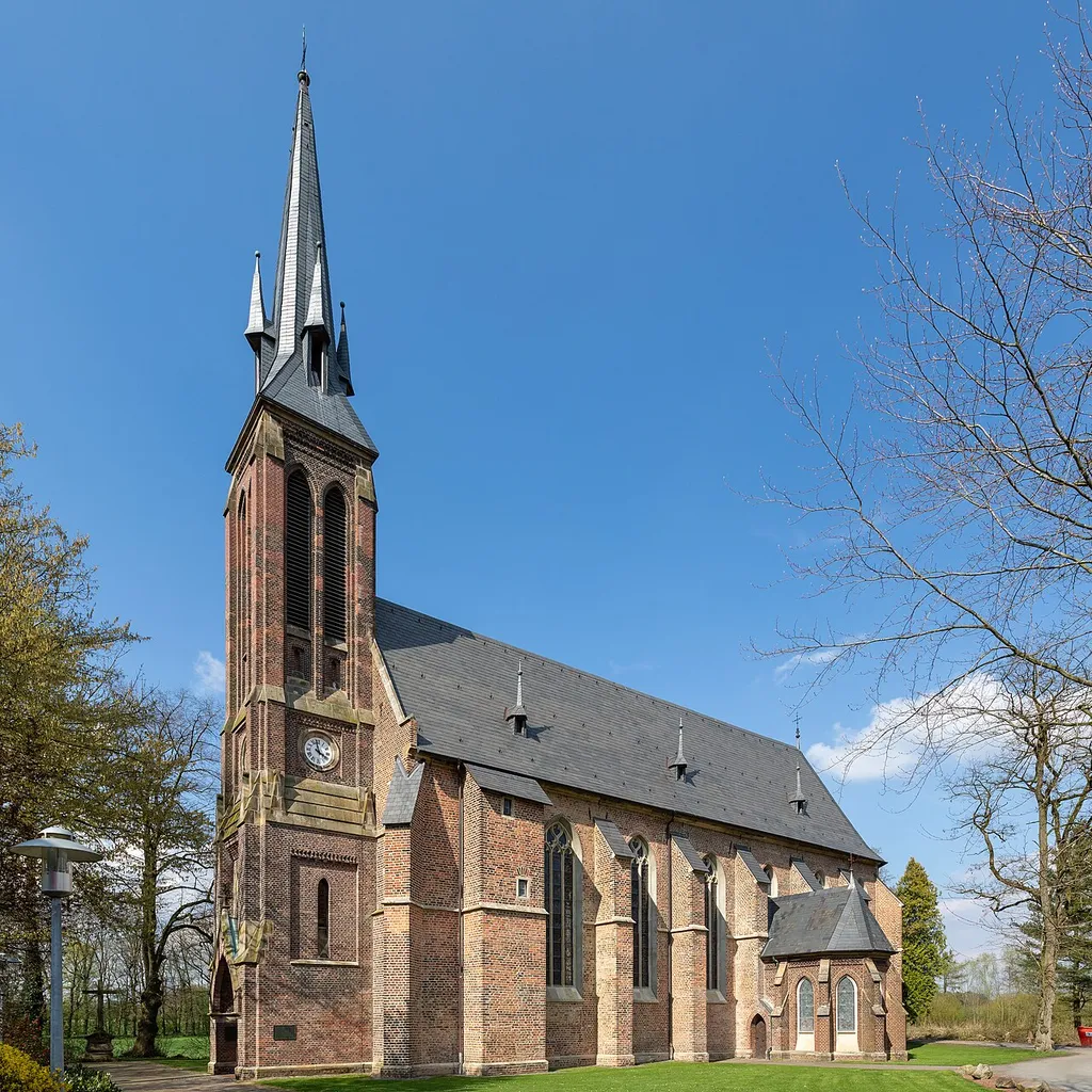 St Jacob’s Church, Kirchspiel, Dülmen, North Rhine-Westphalia, GermanyThe church belongs to the former Marienburg Charterhouse – the only Carthusian monastery in Westphalia. The order came to Weddern in 1476/77 after the knight Gerd von Keppel donated his castle to the order. The charterhouse was inhabited until 1803.Construction of the church itself began in 1477, but remained unfinished for a long time; the keystone in the western bay bears the date 1607. After the monastery was dissolved, the building remained standing and is now used as a parish and community center.The church is a late Gothic place of worship built of red brick. The building has a deliberately simple design: a single-nave hall with a vaulted ceiling, choir area, and characteristic tracery windows. A tower with an octagonal pointed roof and dormers characterizes the exterior appearance. In 1871/72, the church was expanded in the neo-Gothic style, with a crypt for the von Croÿ family added and the interior expanded.Particularly noteworthy is the old choir stalls, which probably originate from Cologne and date from around 1350. Also impressive is a Rococo grille from 1752, which visually separates the altar area from the church and is artistically decorated.
